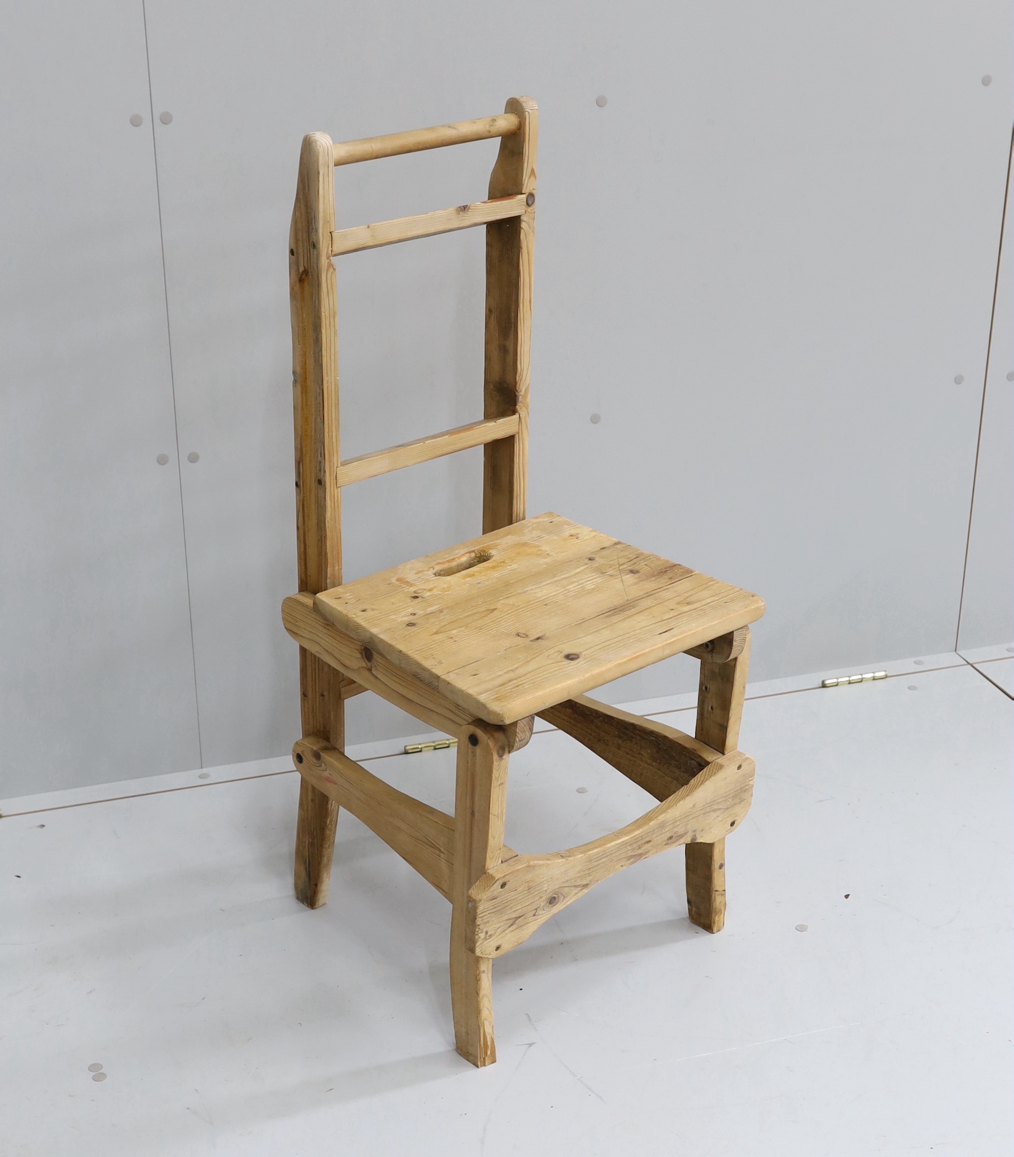 A provincial pine metamorphic library chair